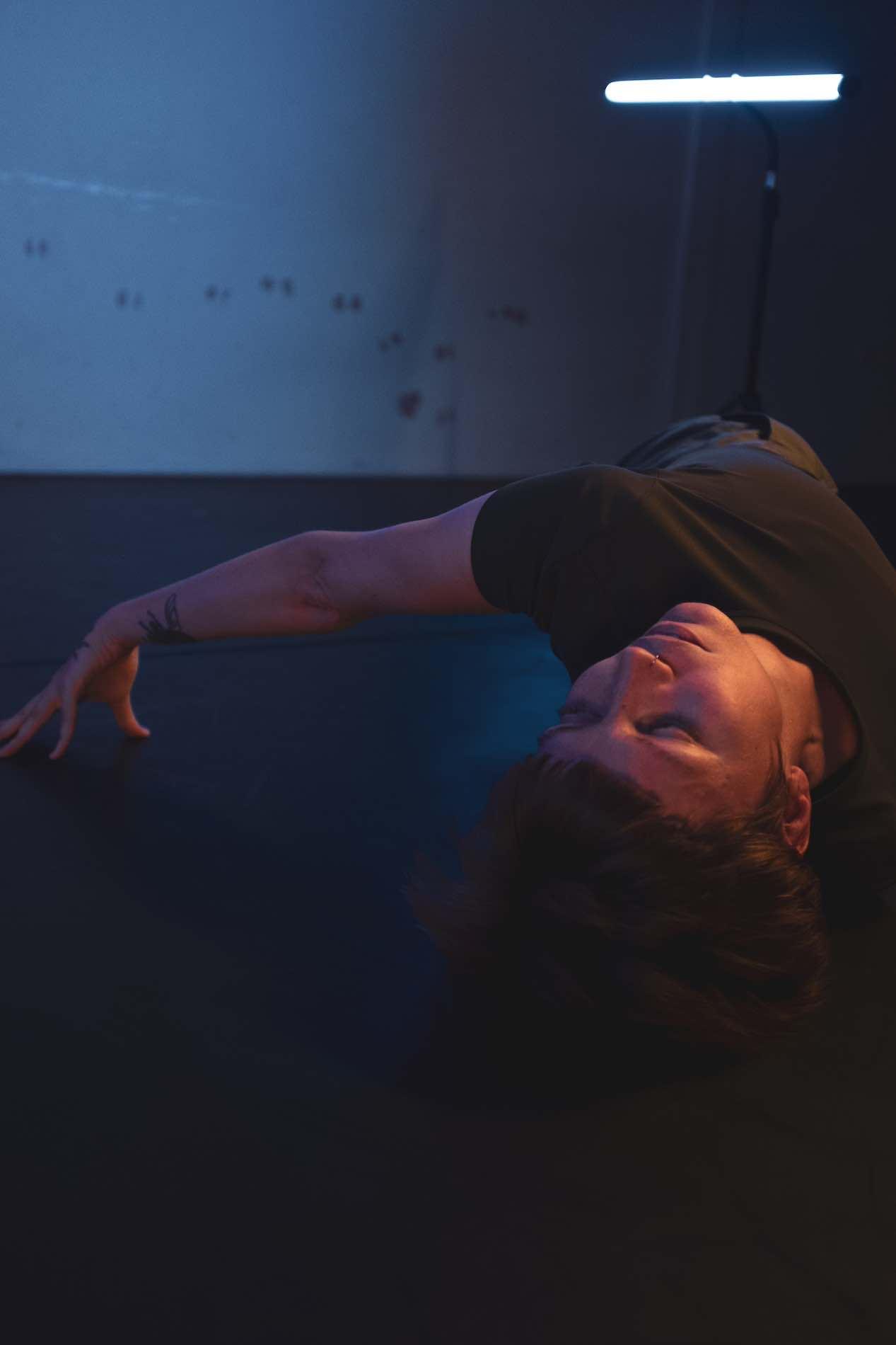 A person is lying on the floor and their limbs are spread unnaturally away from their body.