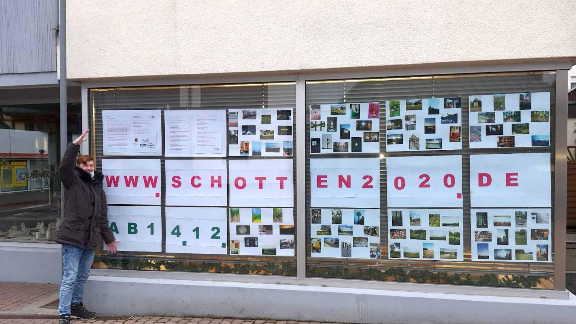 A large poster advertising the finished website has been put up in a large shop window in Schotten.